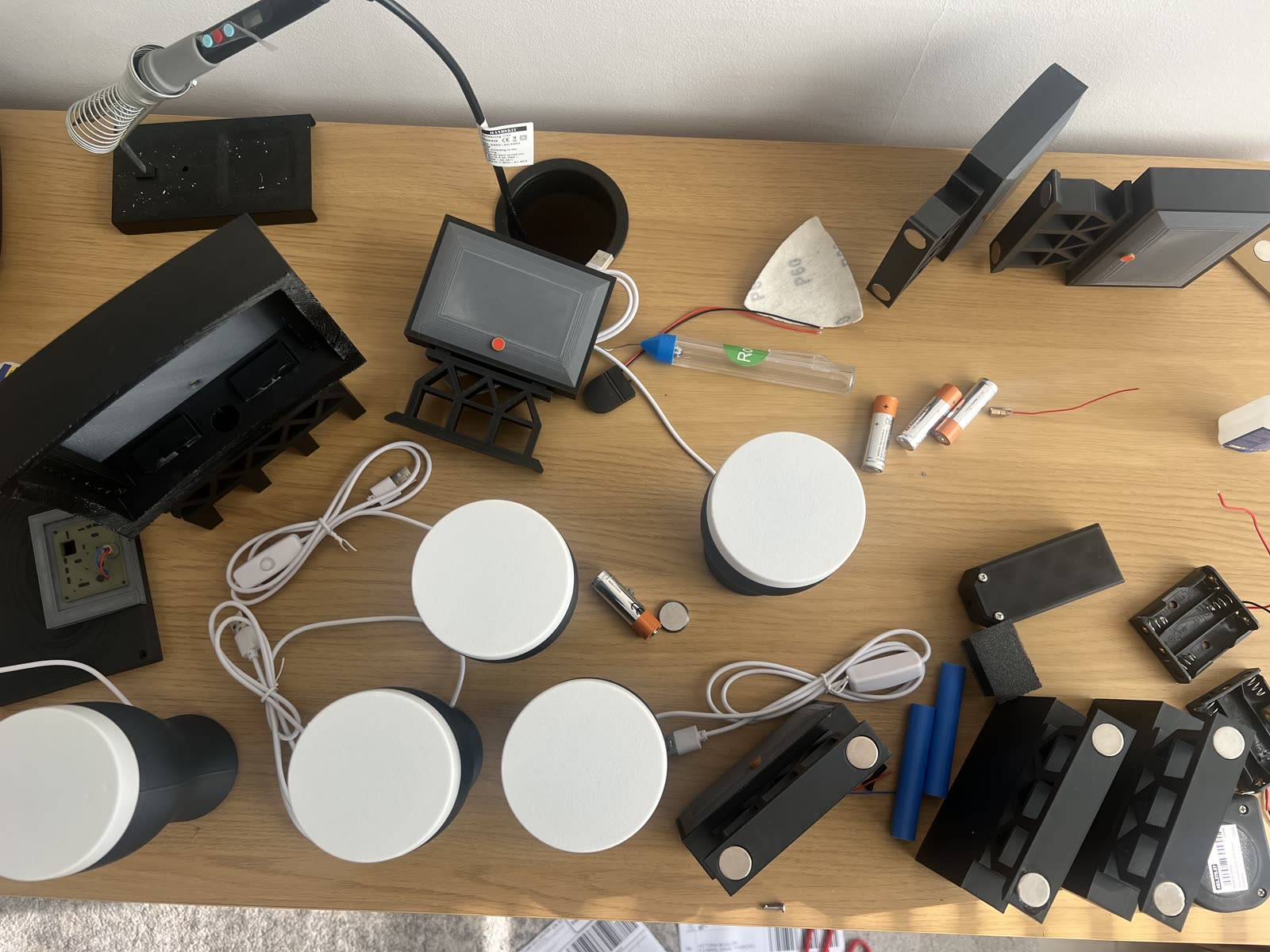 A workbench covered in 3D-printed products ready for shipping