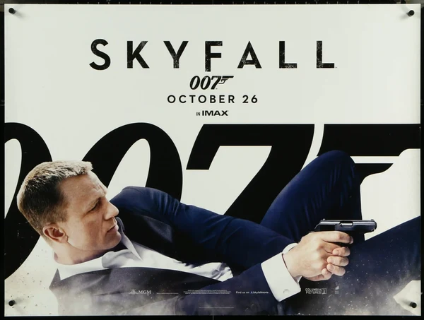 Skyfall 007 film poster with James Bond aiming a gun, pinned to a wall